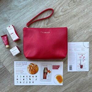 Clarins Vibrant Red Beauty Pouch With Wrist Strap and 5 Skincare Samples
